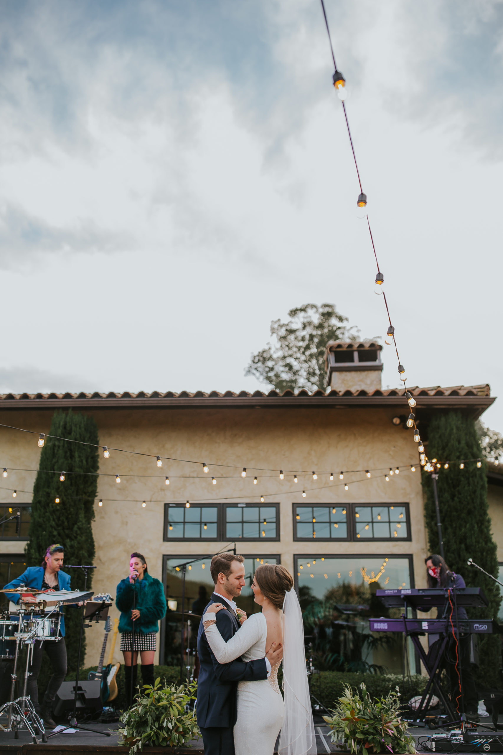 rebecca skidgel photography wine country wedding photographer healdsburg vineyards bride and groom first dance smiling holding each other