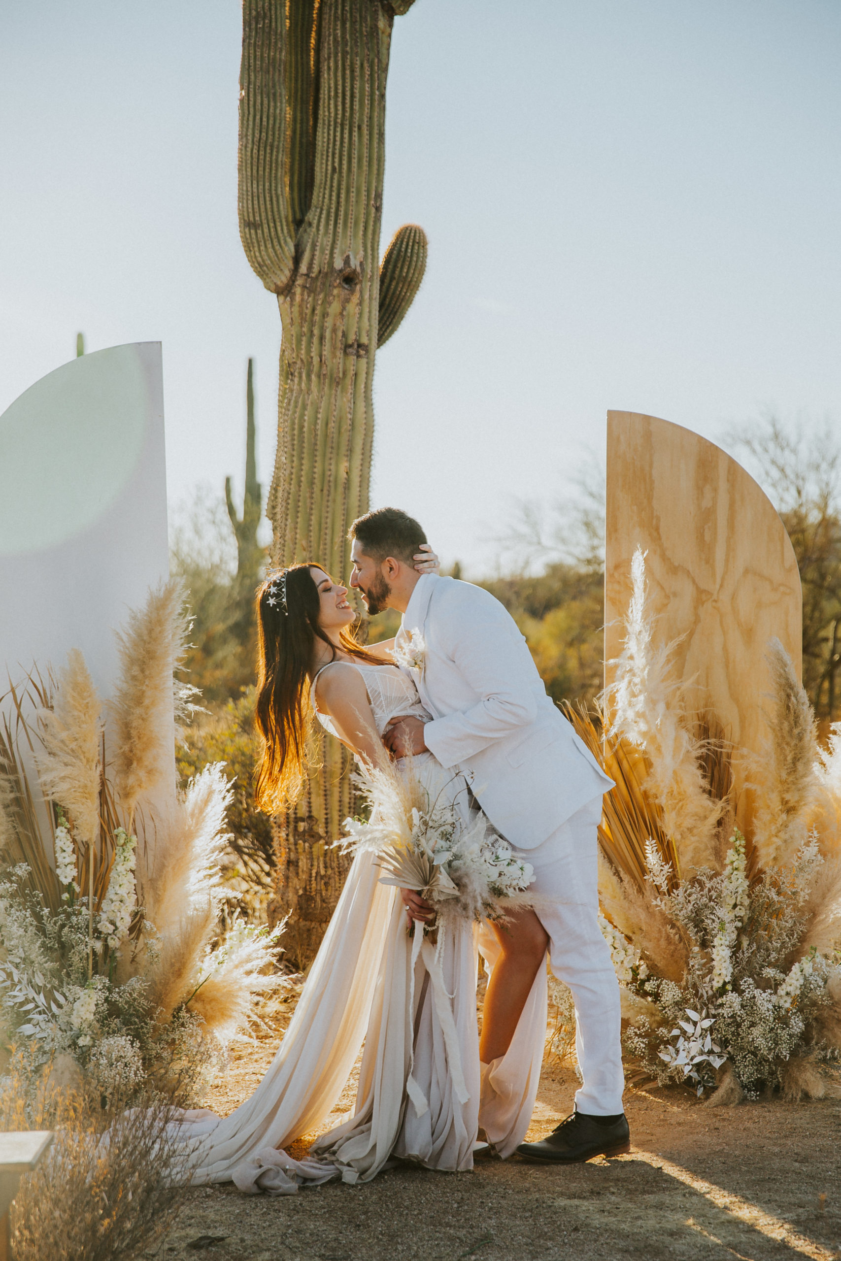 rebecca skidgel photography arizona wedding photgrapher golden hour boho desert bride and groom twilring dancing laughing smiling