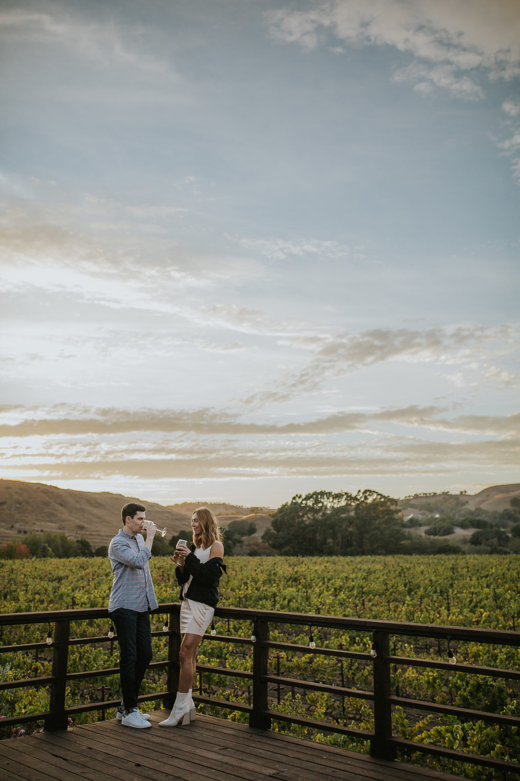 rebecca skidgel photograpy napa wedding photographer engagement session vineyards couple enjoying wine