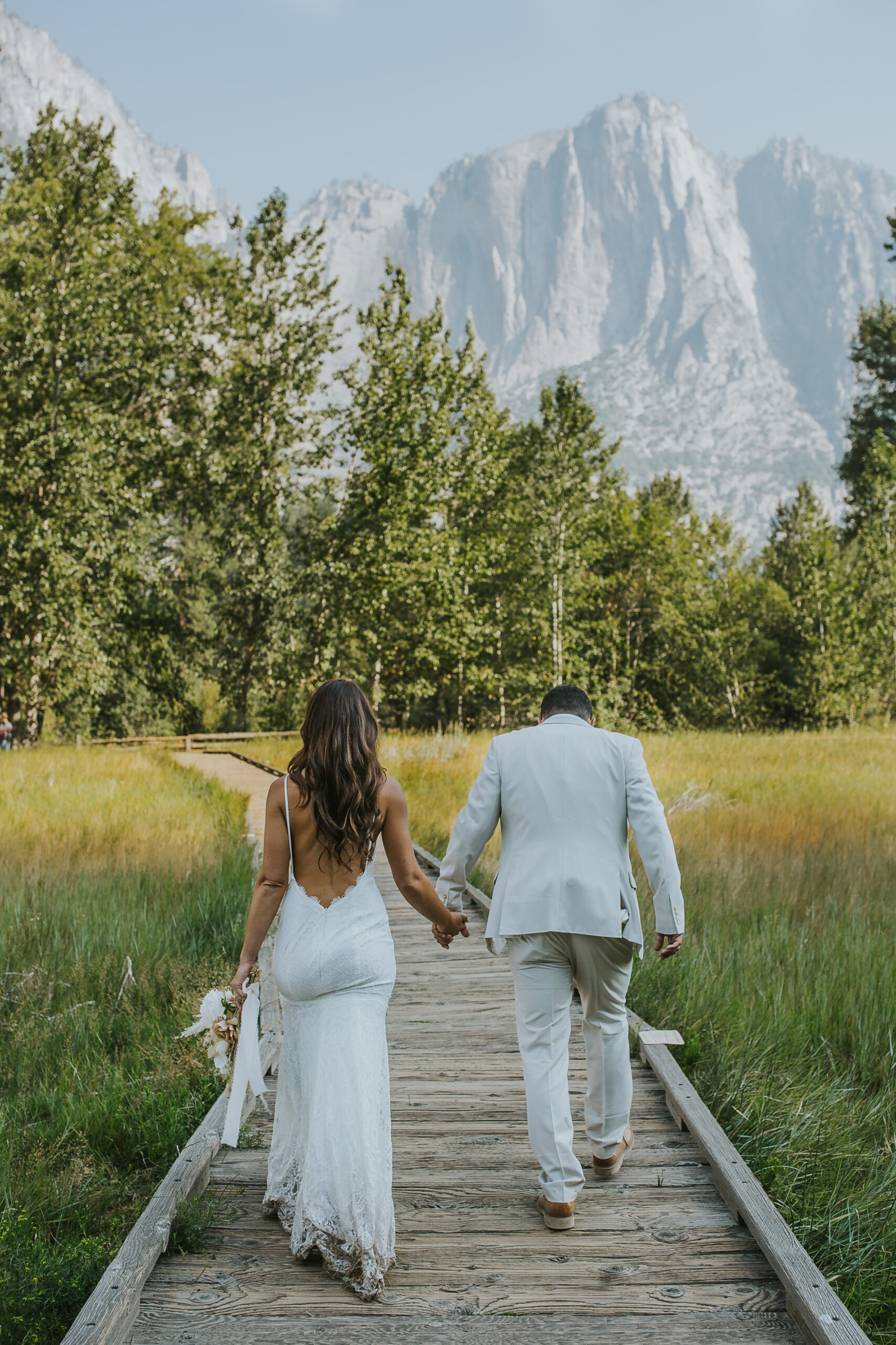 rebecca skidgel photography california elopement photographer yosemite national park bride groom holding hands walking sunrise