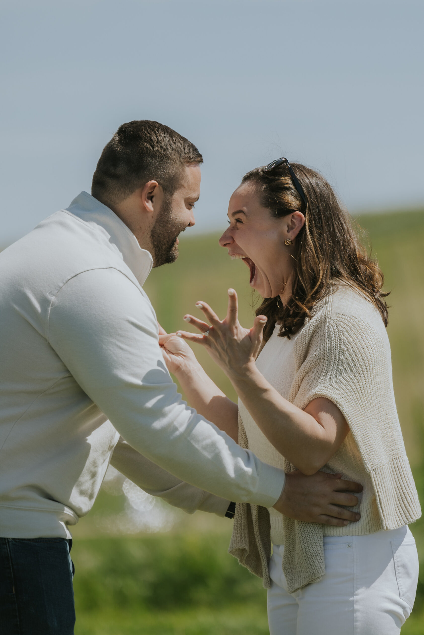 girl excited surprise proposal in the vineyards at the Donum Estate in Sonoma California